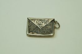 A silver 'envelope' stamp case, by Aide Lovekin Ltd, Birmingham 1907, with engraved decoration, 2.