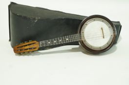 A mandolin with inlaid mother of pearl and faux tortoiseshell with a Stentor banjo