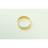 A 22 carat gold wedding ring, of flat section, 5 mm wide, finger size O, 2.