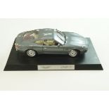 A modern die cast model of an Aston Martin DB7