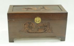 A camphor wood chest, the top and front carved with Chinese figures and pagodas, 48.