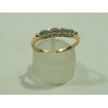 A seven stone diamond half hoop ring, stamped 14K, set with uniform single cuts, finger sixe O1/2,