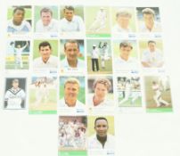 A collection of signed cricket cards,