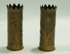 A pair of trench art shell case vases, one inscribed "Ypres" and the other "Somme",