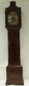 A late 18th century mahogany longcase clock with arched brass dial,