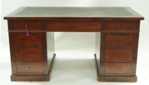 A mahogany pedestal desk with leather inset top,