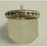 An eternity ring, set with synthetic spinels, stamped '9ct', 2.
