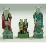 A pair of Chinese porcelain figures decorated in enamels on rectangular bases.