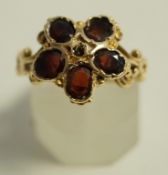 A 14 carat gold five stone garnet ring, in the Victorian style, finger size N1/2, 4.