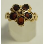 A 14 carat gold five stone garnet ring, in the Victorian style, finger size N1/2, 4.