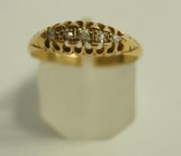 An 18 carat gold five stone diamond ring, set with graduated Swiss cuts, finger size O, 3.