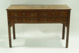 A 19th century oak sideboard with an arrangement of four frieze drawers and brass handles on square