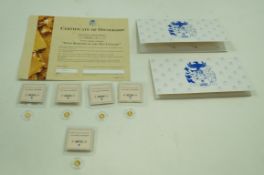 Five 14 carat gold proof coins,