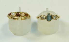 An opal and garnet five stone 9 carat gold ring,