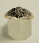 A diamond single stone ring, stamped '18ct' the old brilliant cut of approximately 0.