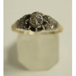 A diamond single stone ring, stamped '18ct' the old brilliant cut of approximately 0.