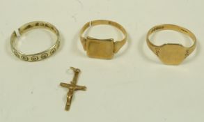A 9 carat gold signet ring; with another similar; a 9 carat gold eternity ring;