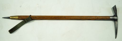 A mid 20th century climbing axe, with an oak shaft,