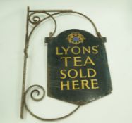 A Lyons tea enamel sign on wrought iron bracket, overall 88.