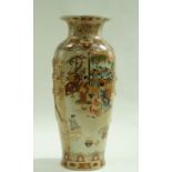 A Japanese earthenware floor vase, decorated with figures on a flower and leaf ground. 82.5cm high.