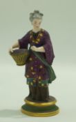A 19th century Meissen style figure of a lady in chinoiserie dress holding a basket and a flower,