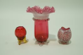 ***WITHDRAWN*** A Victorian cranberry flared glass vase with white glass lined rim and flared leaf