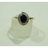 A sapphire and diamond ring, stamped '375',