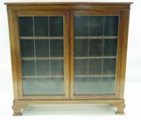A mahogany display cabinet with two lead glazed doors on bracket feet, 118cm high, 121cm wide, 36.