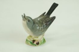 A Beswick figure of a white throat, beak open, first edition, printed marks in black,