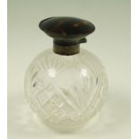 A cut glass scent bottle with silver and tortoiseshell hinged cover, maker D&B, Birmingham 1923,