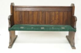 An oak and pine pew with plank back and upholstered seat, 101cm high,