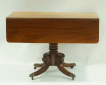 A Victorian mahogany Pembroke table with one frieze drawer on turned pedestal and four splayed legs