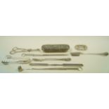 A collection of silver plated items including a cheese scoop; meat skewers;