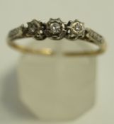 A three stone diamond ring, illusion set with graduated brilliant and single cuts, finger size S, 2.