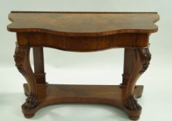 A Victorian and later walnut serpentine fronted console table on carved shaped legs with paw feet