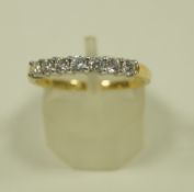 A seven stone diamond 18 carat gold half hoop ring, the uniform brilliant cuts, 0.