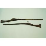 A pair of 19th century Middle Eastern guns, with brass and steel mounts,