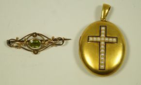 A Victorian locket, circa 1880, with a pearl set cross motif (pearls untested and unwarranted),
