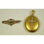 A Victorian locket, circa 1880, with a pearl set cross motif (pearls untested and unwarranted),