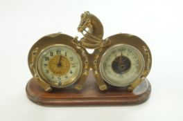 A desk clock and barometer in brass horse shoe frame on mahogany plinth, 20cm wide, 13.