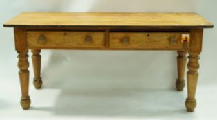 A Victorian pine side table with two frieze drawers, turned handles and turned legs, 73cm high,