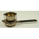 A silver tea strainer, maker F.