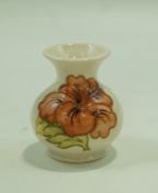 A Moorcroft vase decorated with an hibiscus flower, impressed and painted factory marks, 19.