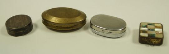 A silver circular pill box; and a brass snuff box;