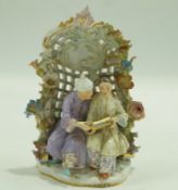 A late 19th century Meissen style arbor group with two figures seated wearing Chinese style clothes,