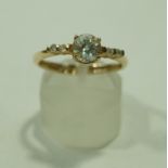 A 9ct gold synthetic stone set dress ring, 1.