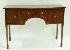 An Edwardian mahogany serpentine fronted sideboard with one cupboard door and one cellarette drawer