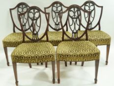 A set of five early 20th century Sheraton style mahogany dining chairs,