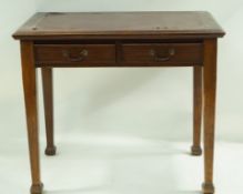 A mahogany writing table with two frieze drawers on square tapering legs with splayed feet,