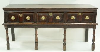 A 17th century and later oak dresser base with mahogany cross banding,